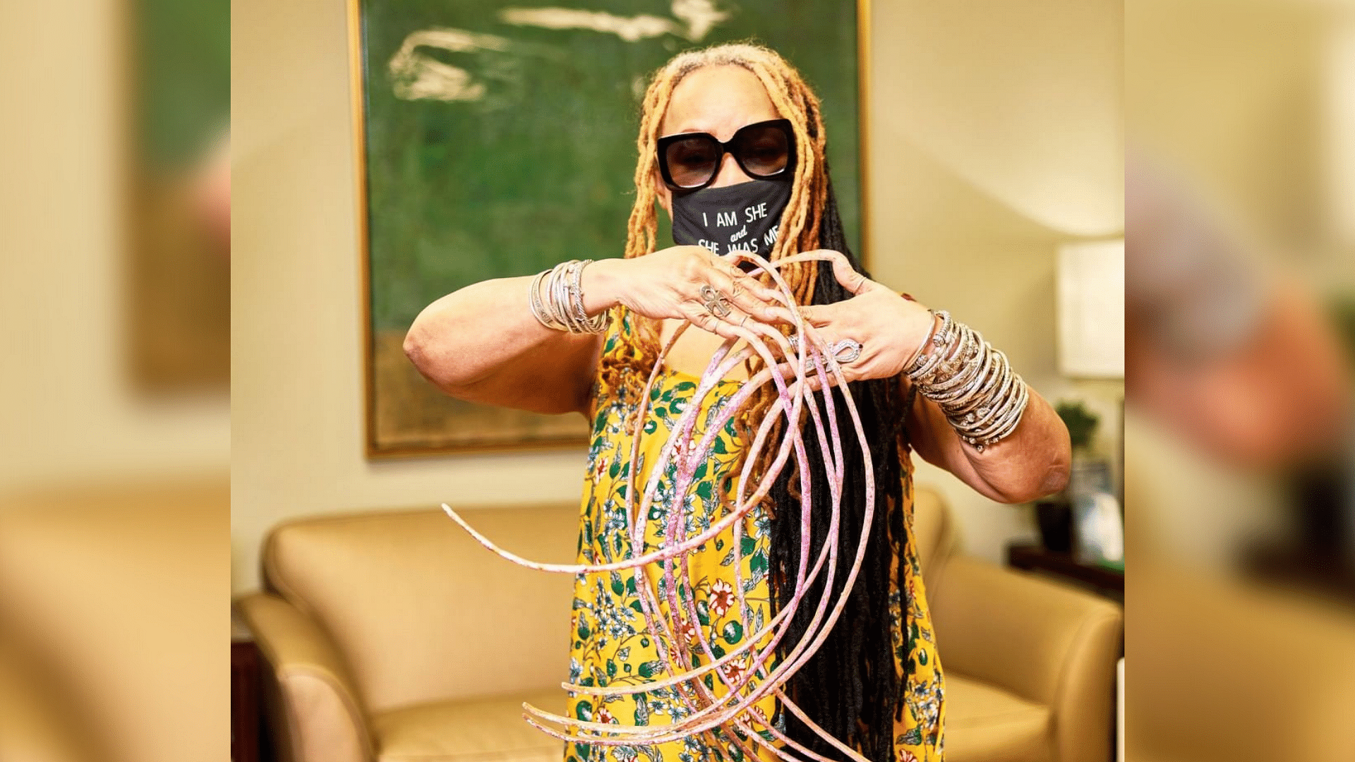 Longest acrylic nails? Tampa's Odilon Ozare sets Guinness record